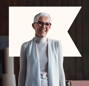 woman smiling with white klaviyo logo behind her
