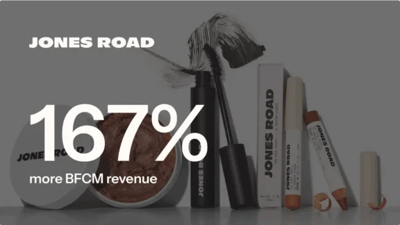 Jones Road cosmetics with text "167% more BFCM revenue" overlaid. Includes mascara, face pencil, and makeup pot.