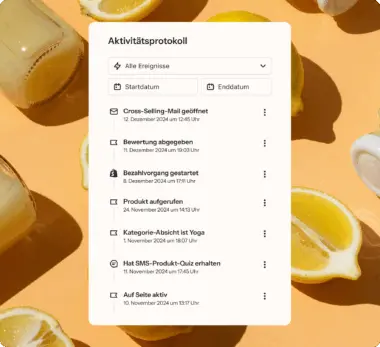 Aktivitätsprotokoll auf einem Smartphone-Bildschirm, umgeben von Zitronen und einer Flasche auf orangefarbenem Hintergrund.