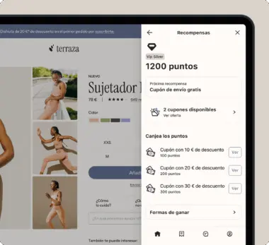 Pantalla de una tienda en línea mostrando un sujetador deportivo y un panel de recompensas con 1200 puntos y cupones disponibles.