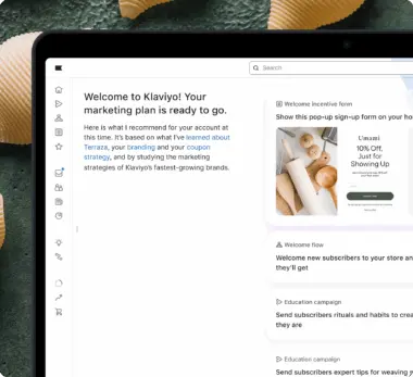 Klaviyo marketing dashboard on a laptop screen, showing a welcome message and marketing plan suggestions.