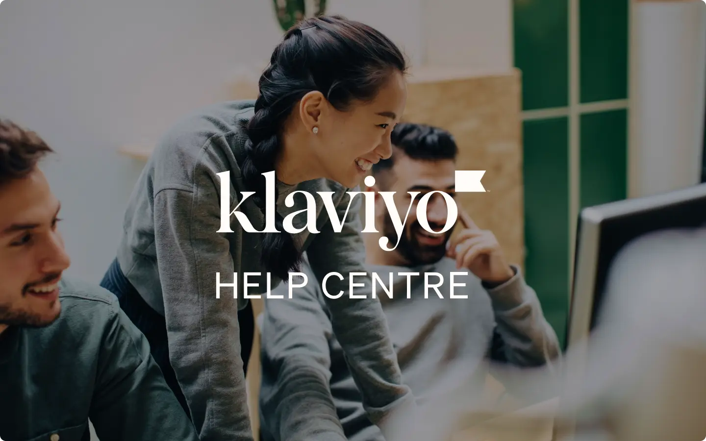 People collaborating at a computer, overlaid with "Klaviyo Help Centre" text.