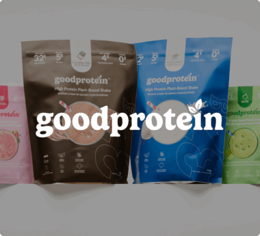 Various GoodProtein product packages, including plant-based shakes in chocolate and vanilla flavors, with the brand name prominently displayed.