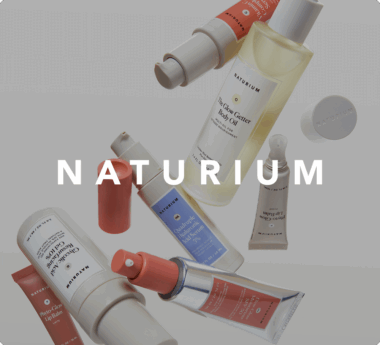 Assorted Naturium skincare products with the brand name "NATURIUM" overlaid in bold white text.