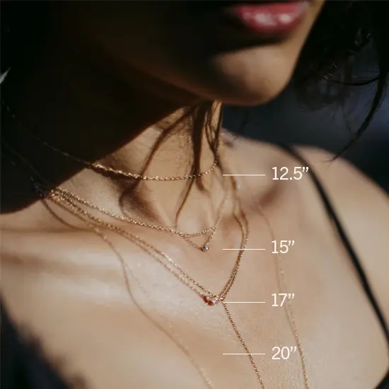 Catbird necklaces layered on a female neck