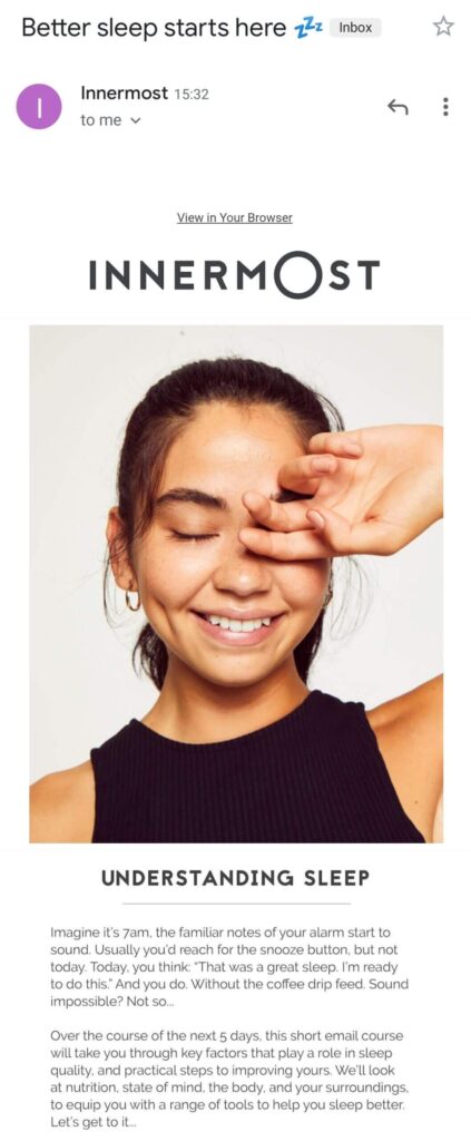 brunette girl smiling with a hand over her eye