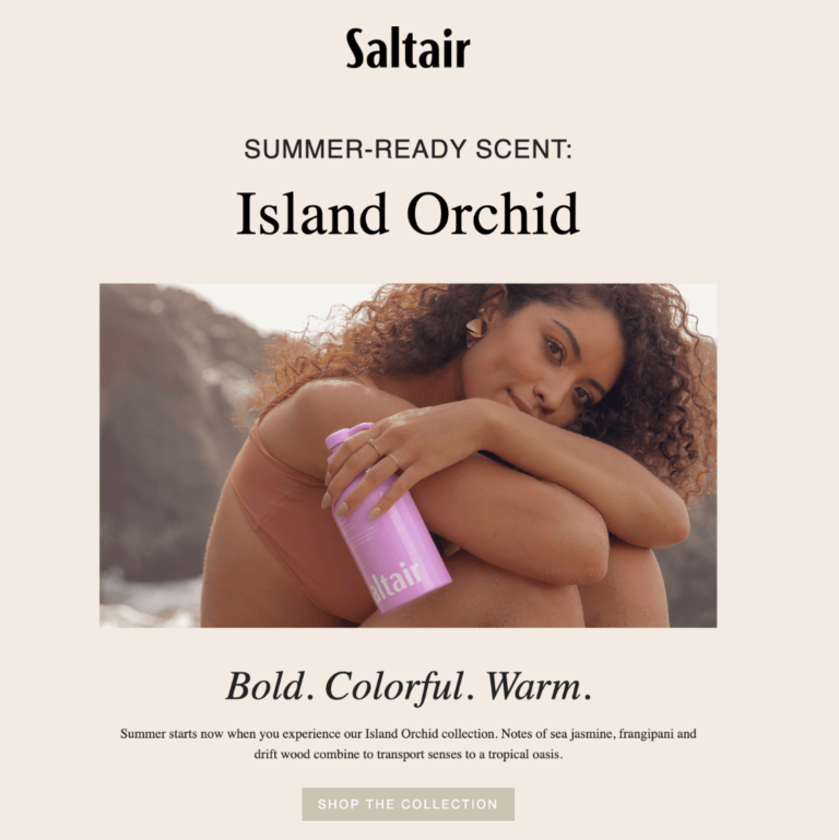 a girl with curly hair holding a pink bottle