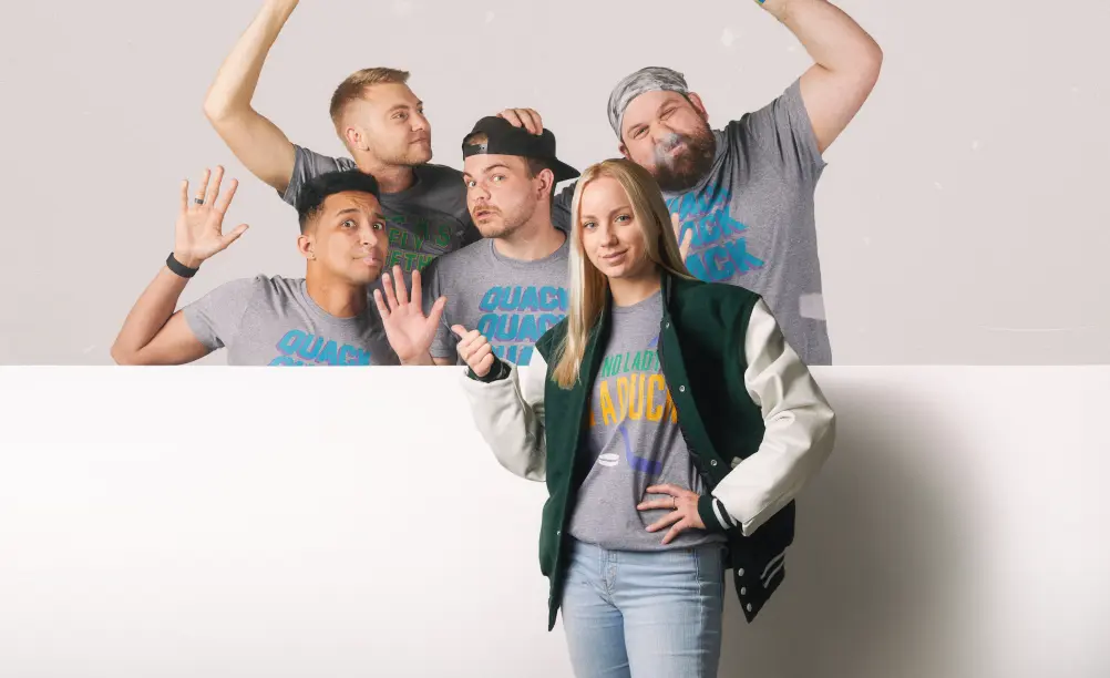 A group of people standing and wearing apparel from HOMAGE.