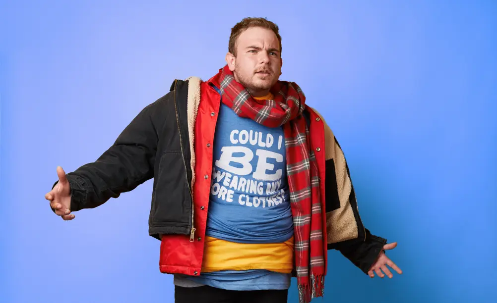 A man standing wearing shirts from HOMAGE.