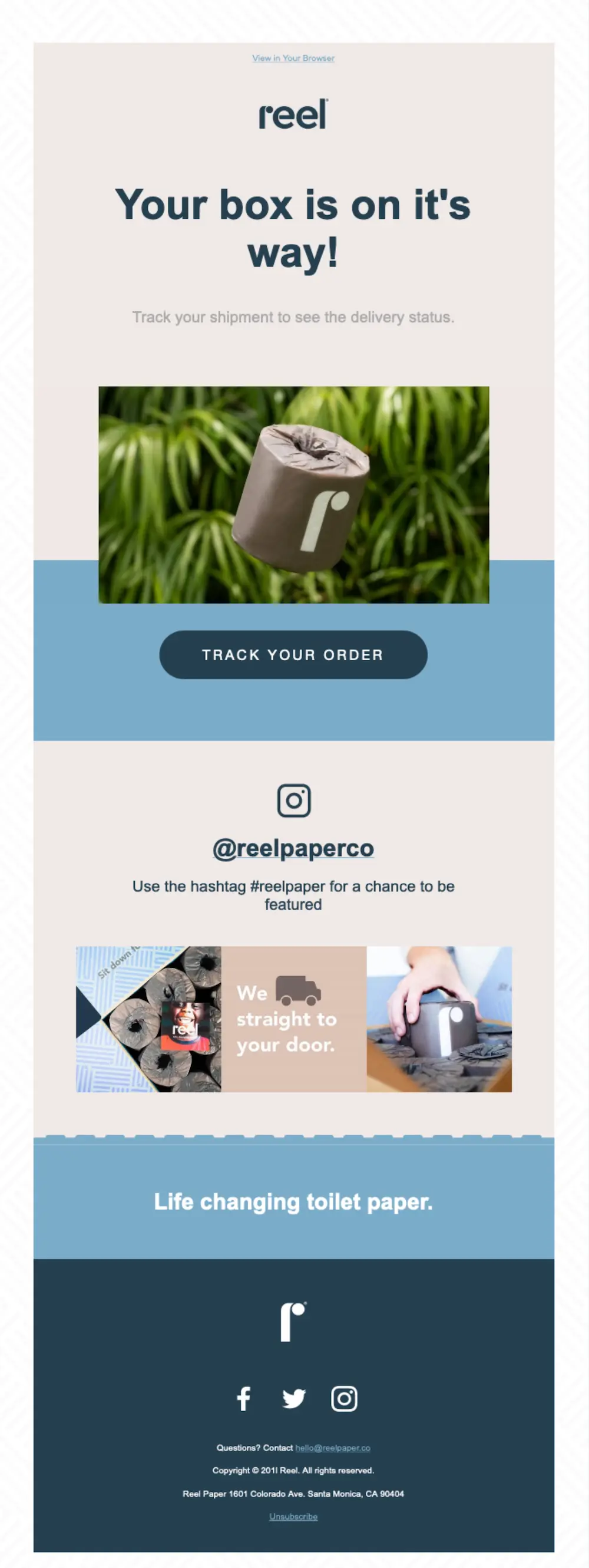 Reel's shipping confirmation email says "Your box is on it's way" with a picture of a roll of toilet paper, branded design, and a preview of their Instagram.