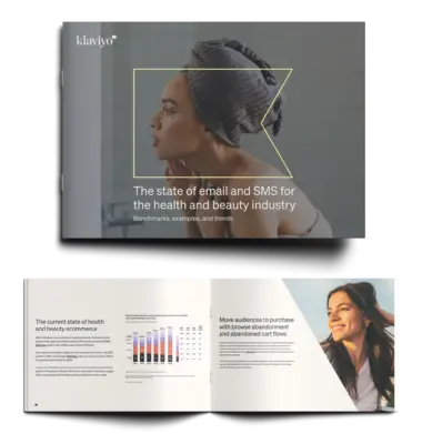 Klaviyo logo outline highlighting a woman with a towel turban looking at the mirror