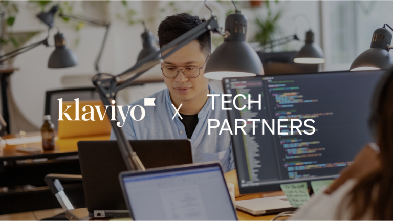 Klaviyo x Tech partners over person sitting at desk in front of computer
