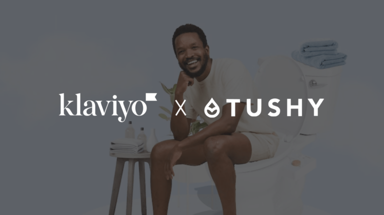 Text reading "Klaviyo and Tushy. In the background, a smiling man sitting on a toilet (but fully clothed!)