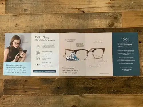 Image shows a direct mail brochure from Felix Gray, featuring a photo of a model wearing their glasses, facts and figures about digital eye strain, product features of their blue-light-filtering glasses, a product diagram illustrating those features, and some additional product copy encouraging the recipient to learn more.