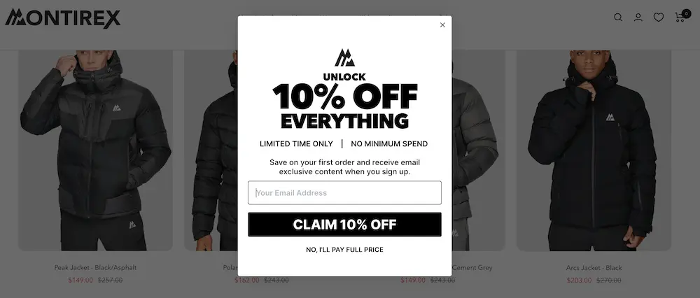 This is an example of a piece of an integration campaign. Image shows the first screen of a multi-step pop-up form that greets a website visitor who lands on the Montirex website. The pop-up form is white with black font. At the top is the Montirex logo, followed by a headline that reads, “UNLOCK 10% OFF EVERYTHING.” The next line reads, “LIMITED TIME ONLY. NO MINIMUM SPEND. Save on your first order and receive email exclusive content when you sign up.” The form contains one field where the viewer can input their email address, then click the black CTA button that reads, “CLAIM 10% OFF.” At the bottom of the form is a smaller link option that reads, “NO, I’LL PAY FULL PRICE.”