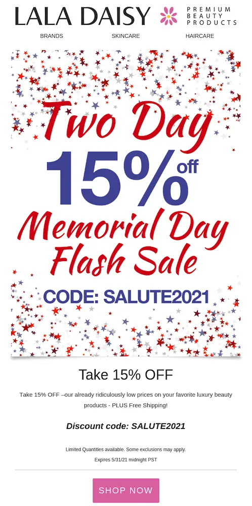Image shows a Memorial Day email campaign from cosmetics brand Lala Daisy, featuring red and blue text on a white background sprinkled with a confetti of red, silver, and blue stars. The email headline reads “Two day Memorial Day flash sale” in red, with “15% off” and “code: salute2021” in blue. Beneath the art, black copy on a white background reads, “take 15% off our already ridiculously low prices on your favorite luxury beauty products—PLUS free shipping!” The email ends with a pink CTA button that reads “shop now.”