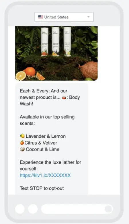 Image shows a promotional text from clean beauty brand Each & Every, which reads, “And our newest product is…body wash! Available in our top selling scents: lavender & lemon, citrus & vetiver, coconut & lime. Experience the luxe lather for yourself.” The text includes a drum emoji in the first sentence and an emoji corresponding to each scent, as well as a product shot at the top and a link to shop at the bottom.