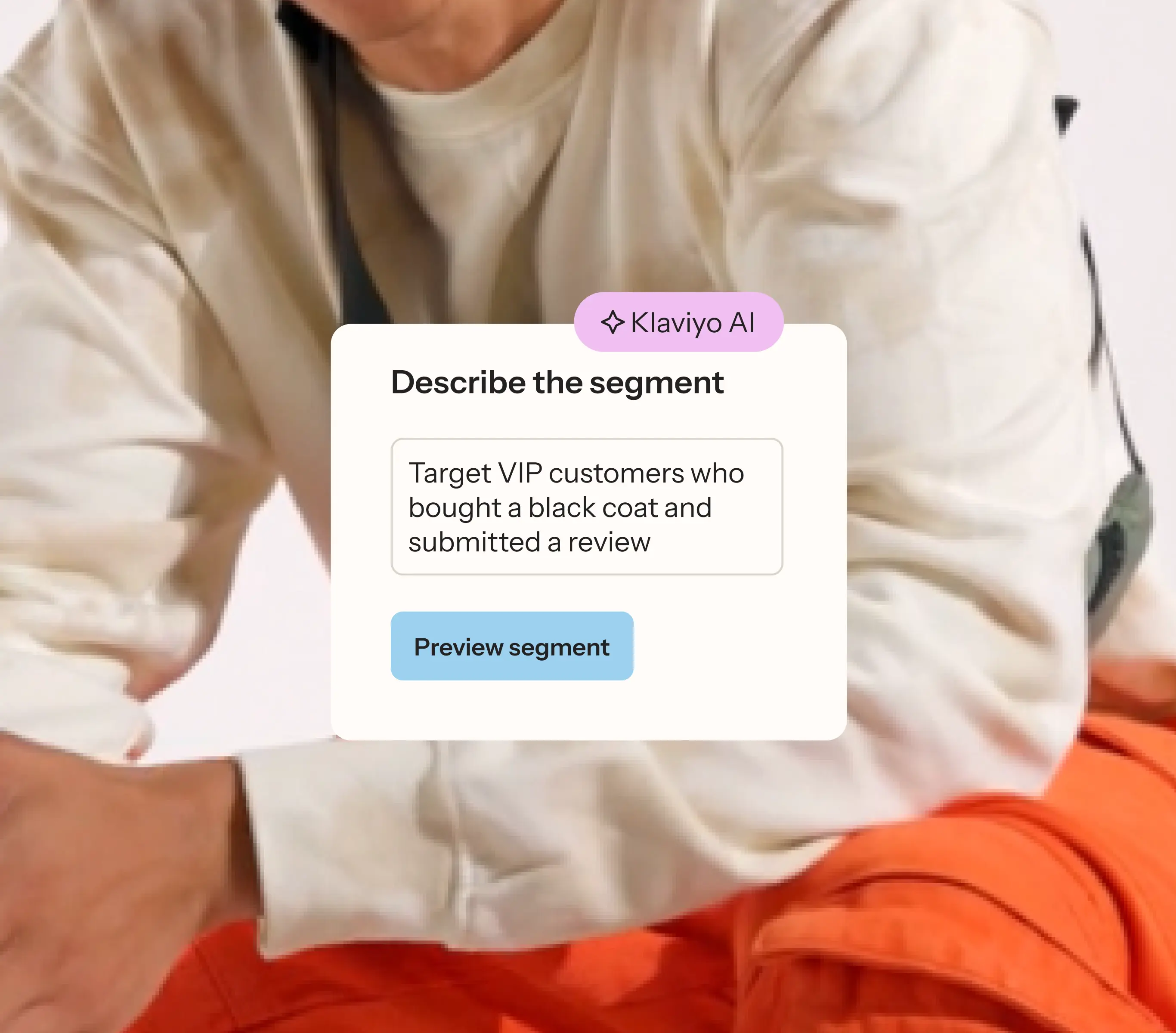 UI card overlaying a fashion image, showing Klaviyo AI generating a segment targeting VIP customers who bought a black coat and submitted a review.