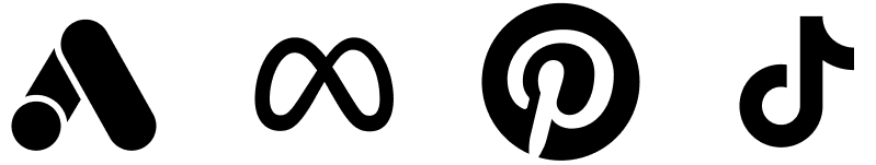 A person in a black hoodie and shorts performs a skateboard trick on a ramp in a skatepark.